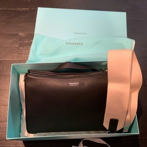 Brand NEW with dust bag and box. Tiffany LEA BLACK CROSSBODY.